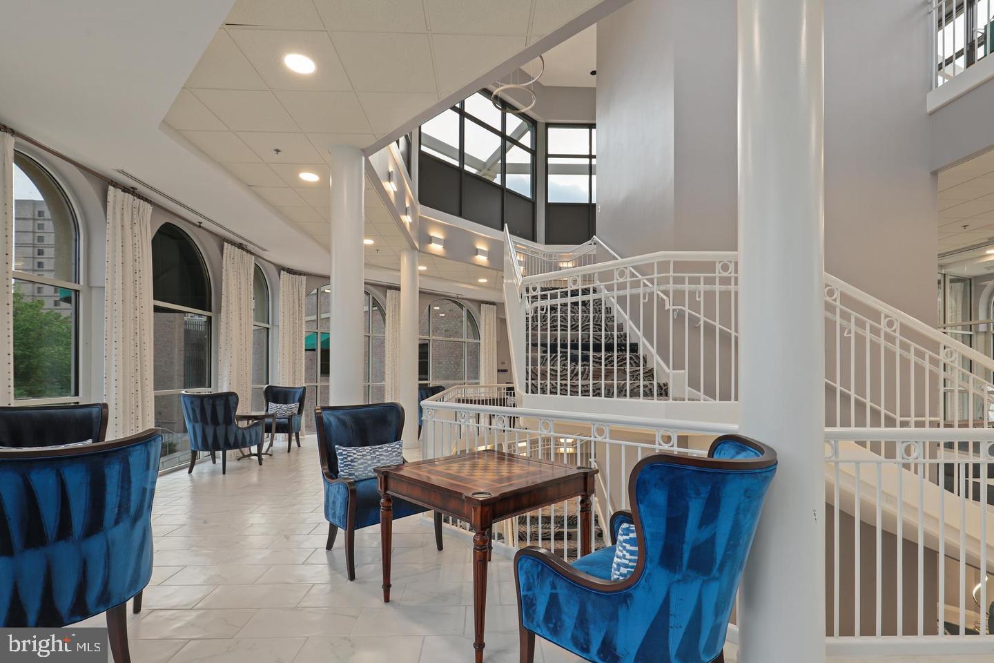 19385 Cypress Ridge Terrace, Unit 914 Leesburg, VA 20176 - Photo 39 of 39 a dining room with furniture window and wooden floor