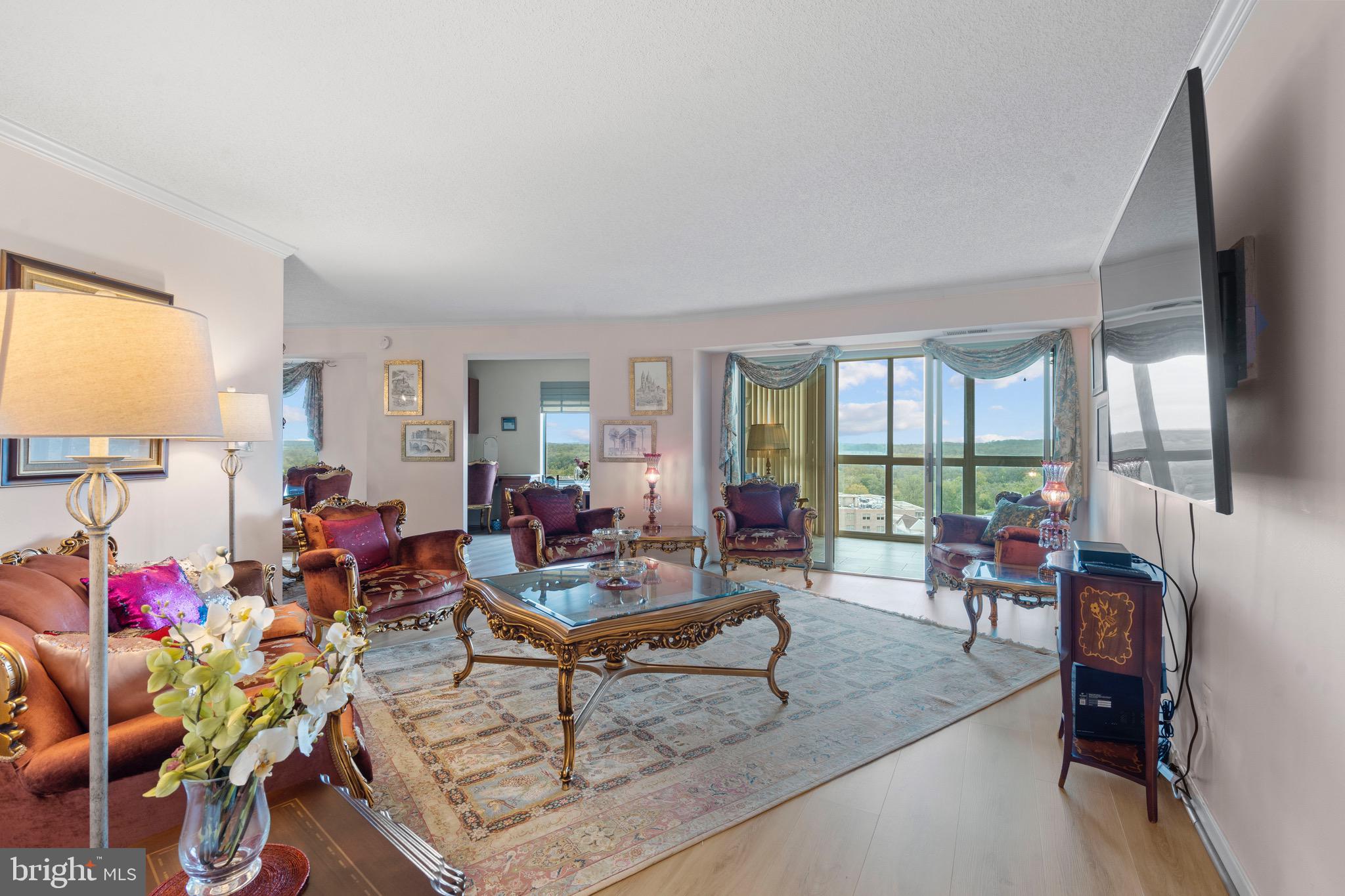 19385 Cypress Ridge Terrace, Unit 914 Leesburg, VA 20176 - Photo 4 of 39 a living room with furniture and a large window