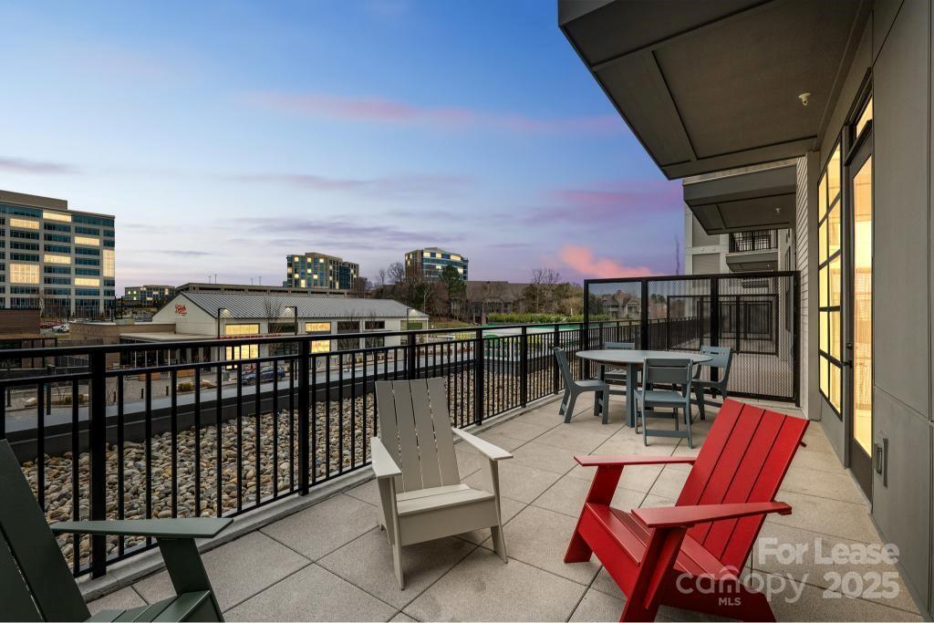 14020 Stream Way, Unit C02B Charlotte, NC 28277 - Photo 18 of 18 a view of roof deck with patio