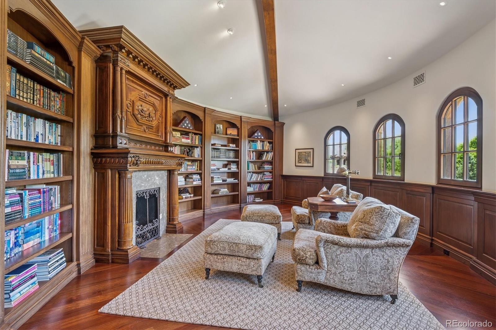 12 Lynn Road Cherry Hills Village, CO 80113 - Photo 11 of 50 a living room with fireplace furniture and a book shelf
