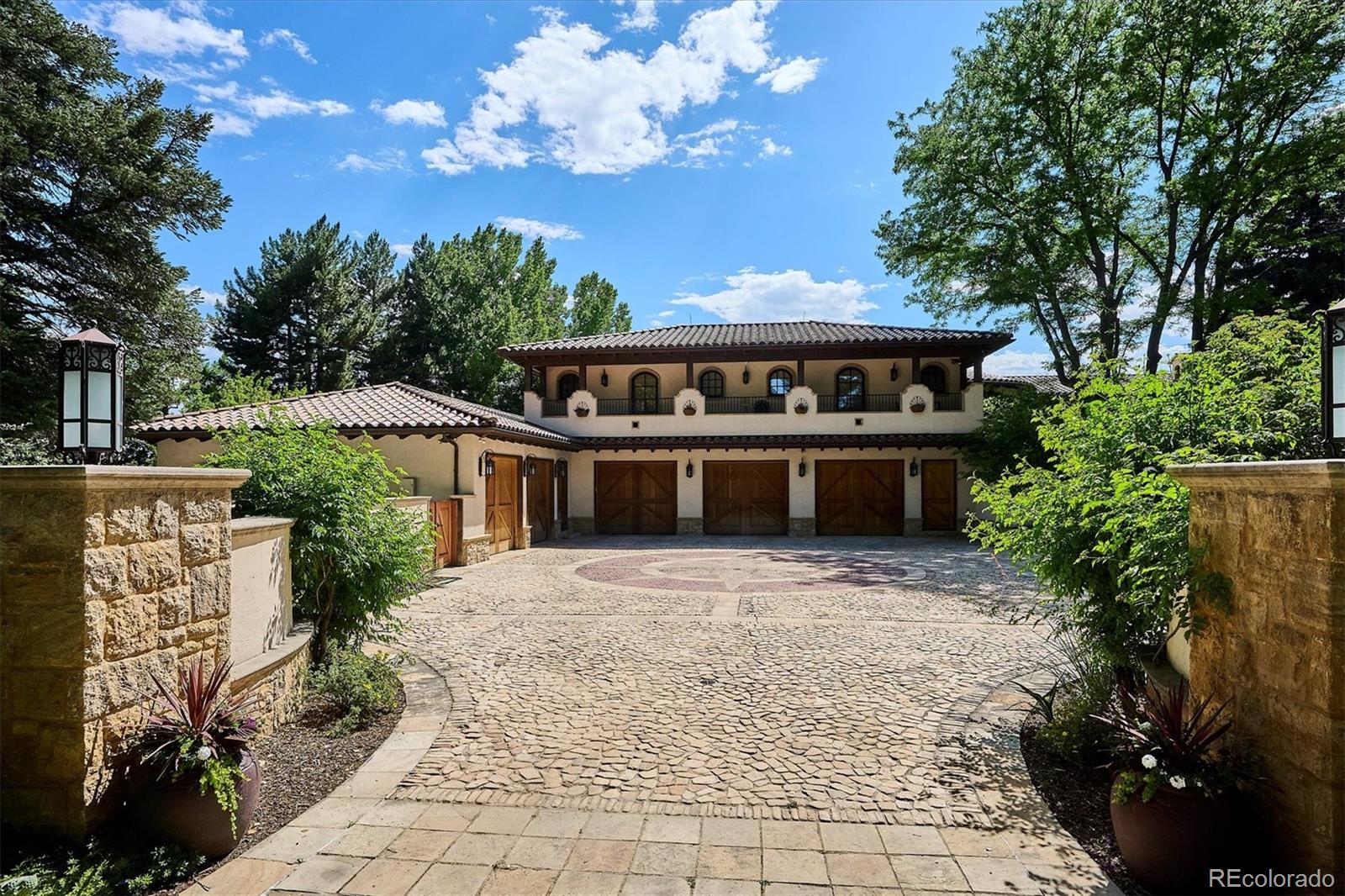 12 Lynn Road Cherry Hills Village, CO 80113 - Photo 24 of 50 a front view of a house with a garden