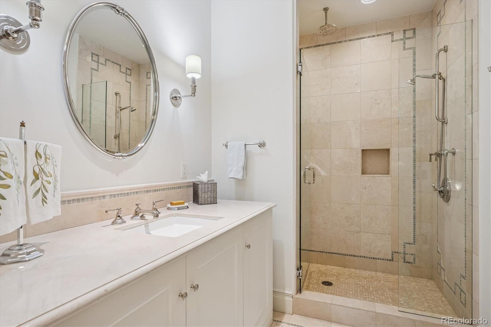 12 Lynn Road Cherry Hills Village, CO 80113 - Photo 27 of 50 a bathroom with a granite countertop sink mirror bathtub and shower