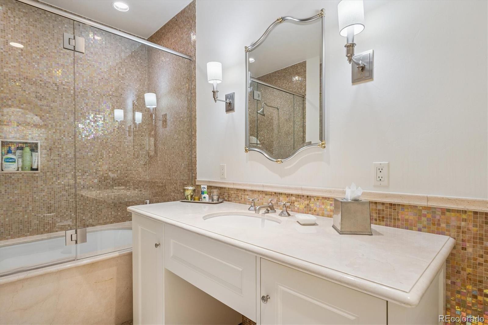 12 Lynn Road Cherry Hills Village, CO 80113 - Photo 29 of 50 a bathroom with a sink vanity granite tub shower and a mirror