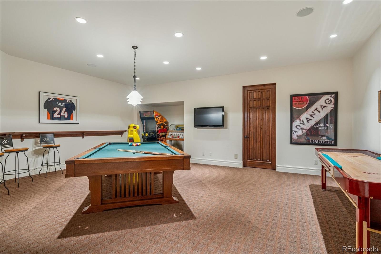 12 Lynn Road Cherry Hills Village, CO 80113 - Photo 31 of 50 a bedroom with furniture and a flat screen tv