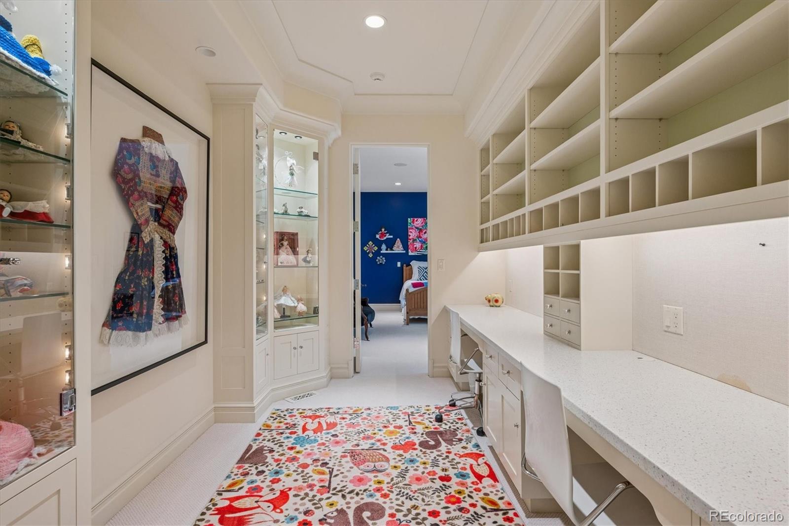 12 Lynn Road Cherry Hills Village, CO 80113 - Photo 39 of 50 a hallway with white cabinets and wooden floor