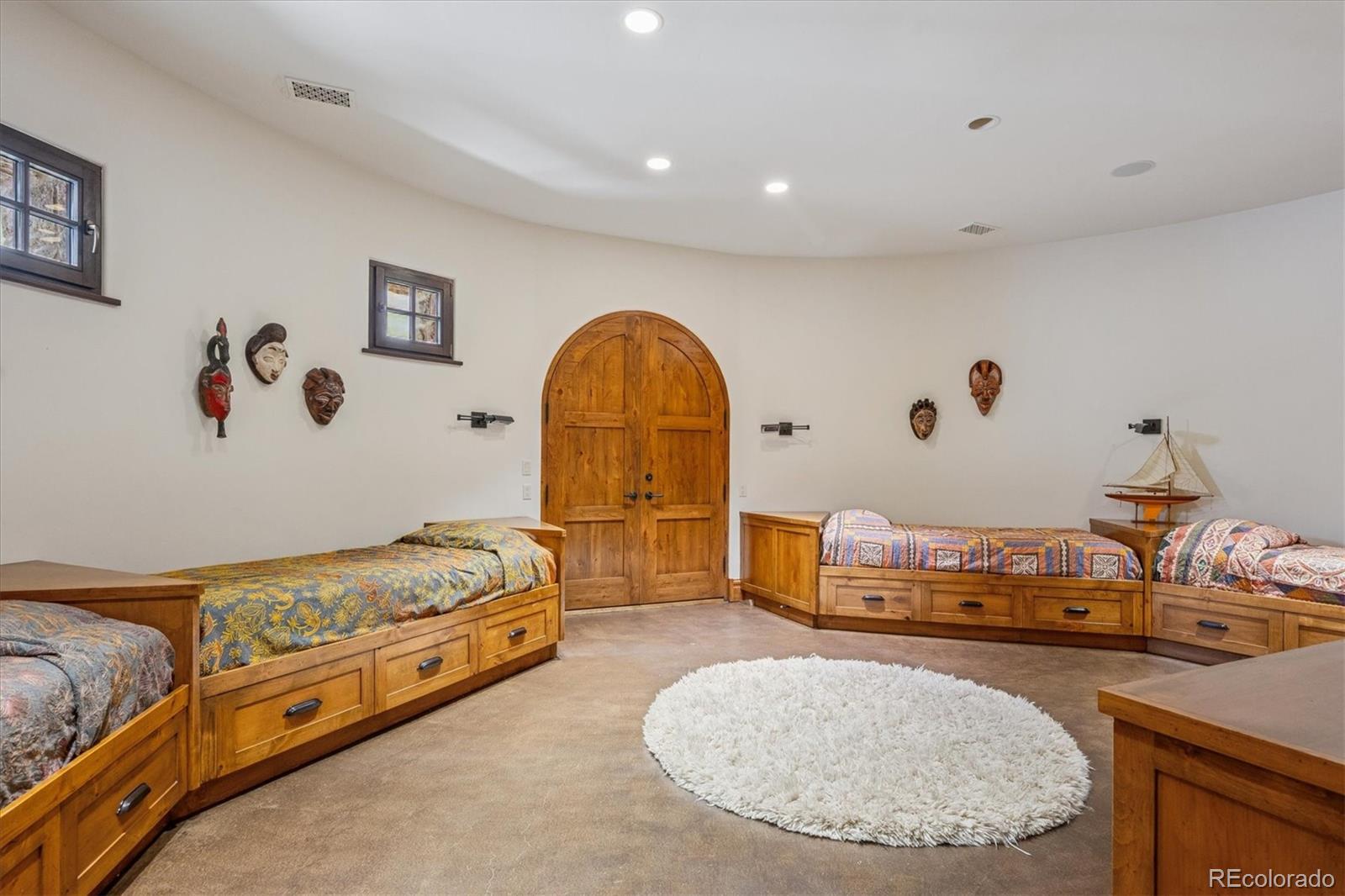 12 Lynn Road Cherry Hills Village, CO 80113 - Photo 48 of 50 a spacious bedroom with a bed and dresser