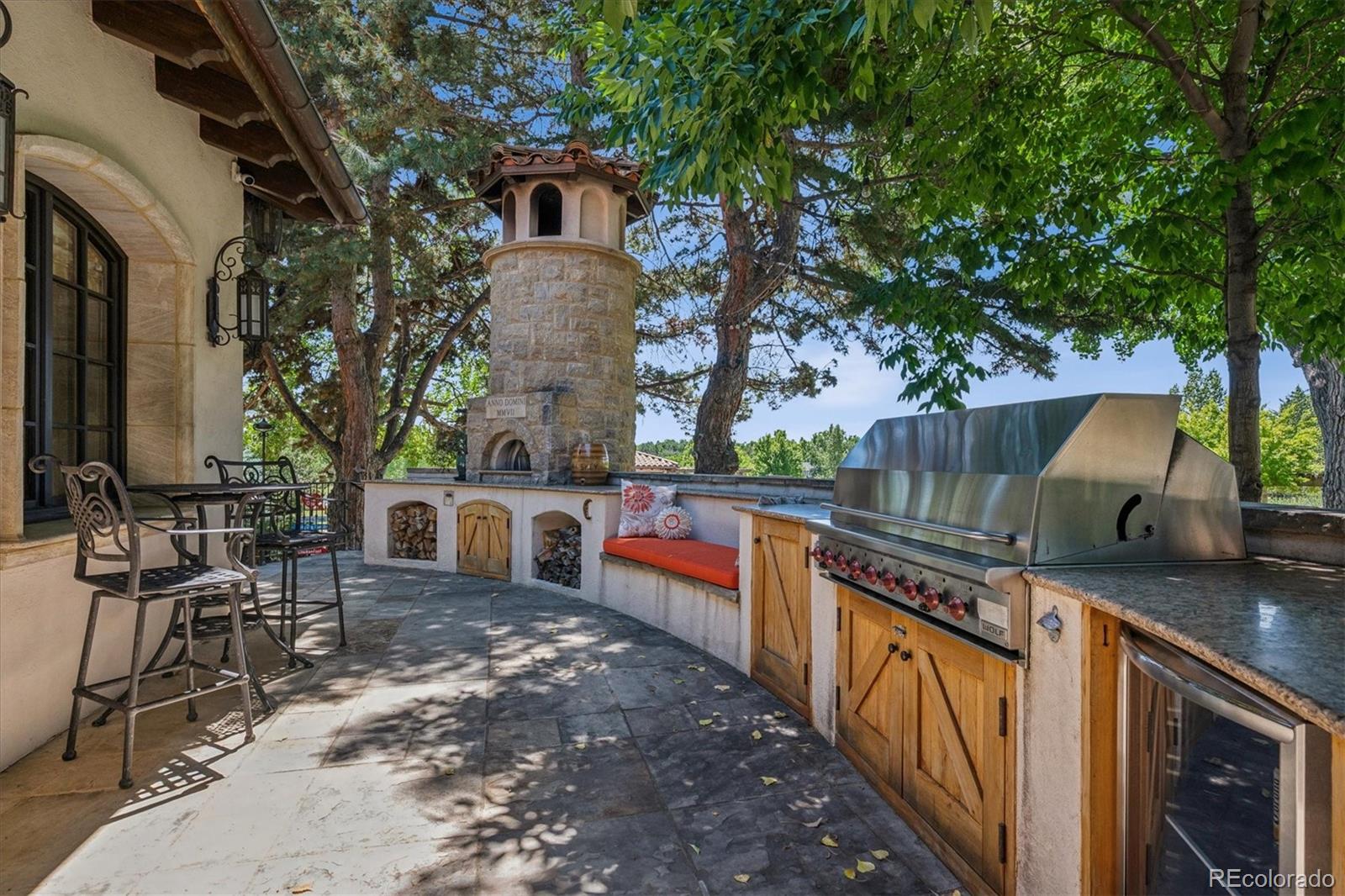 12 Lynn Road Cherry Hills Village, CO 80113 - Photo 5 of 50 a view of a chairs and table in the balcony
