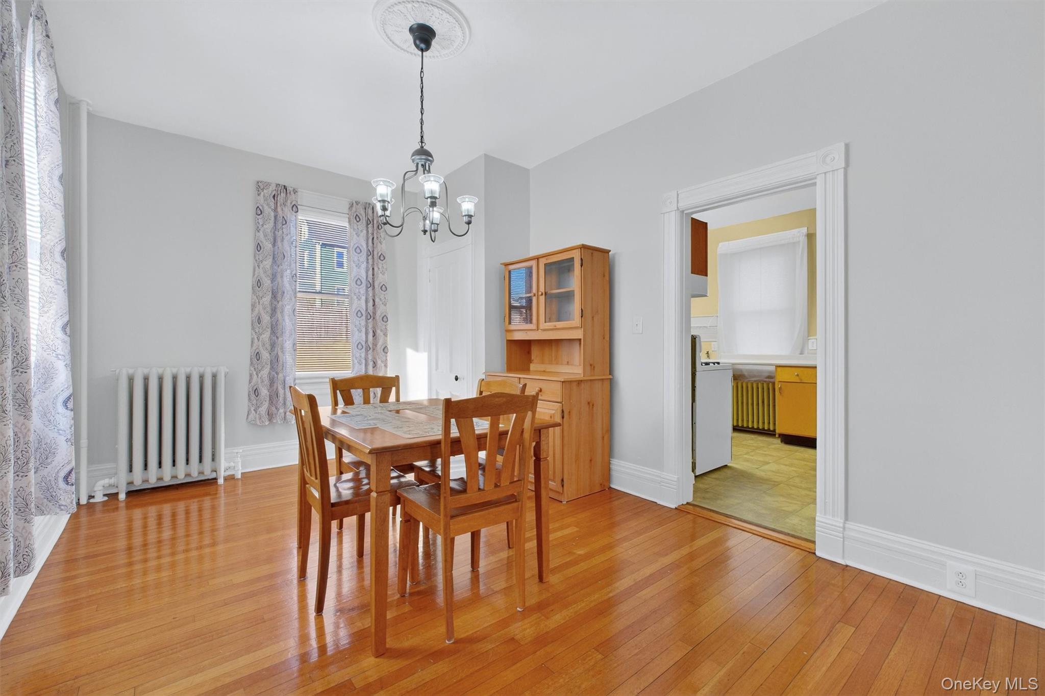 75 Prospect Street Newburgh, NY 12550 - Photo 11 of 37 a view of a dining room with furniture and wooden floor