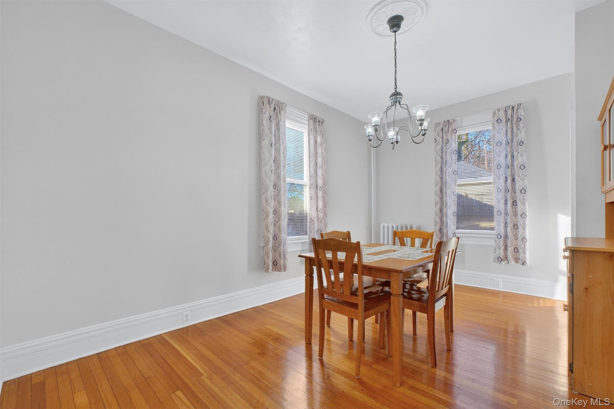 75 Prospect Street Newburgh, NY 12550 - Photo 12 of 37 a view of a dining room with furniture and wooden floor