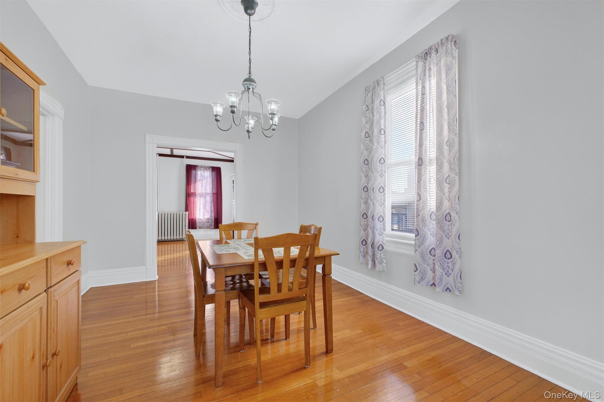 75 Prospect Street Newburgh, NY 12550 - Photo 13 of 37 a view of a dining room with furniture window and wooden floor