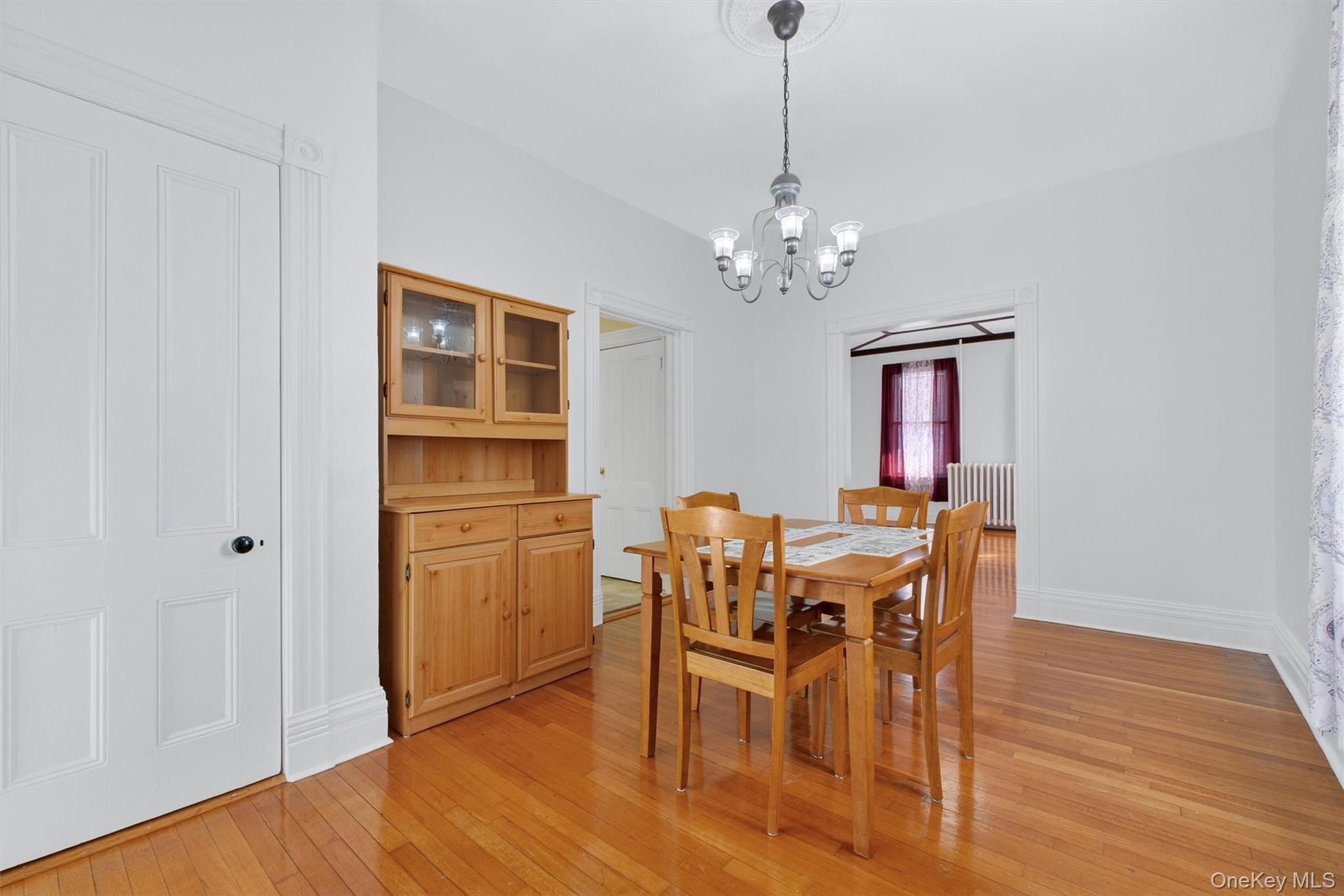75 Prospect Street Newburgh, NY 12550 - Photo 14 of 37 a view of a dining room with furniture and chandelier