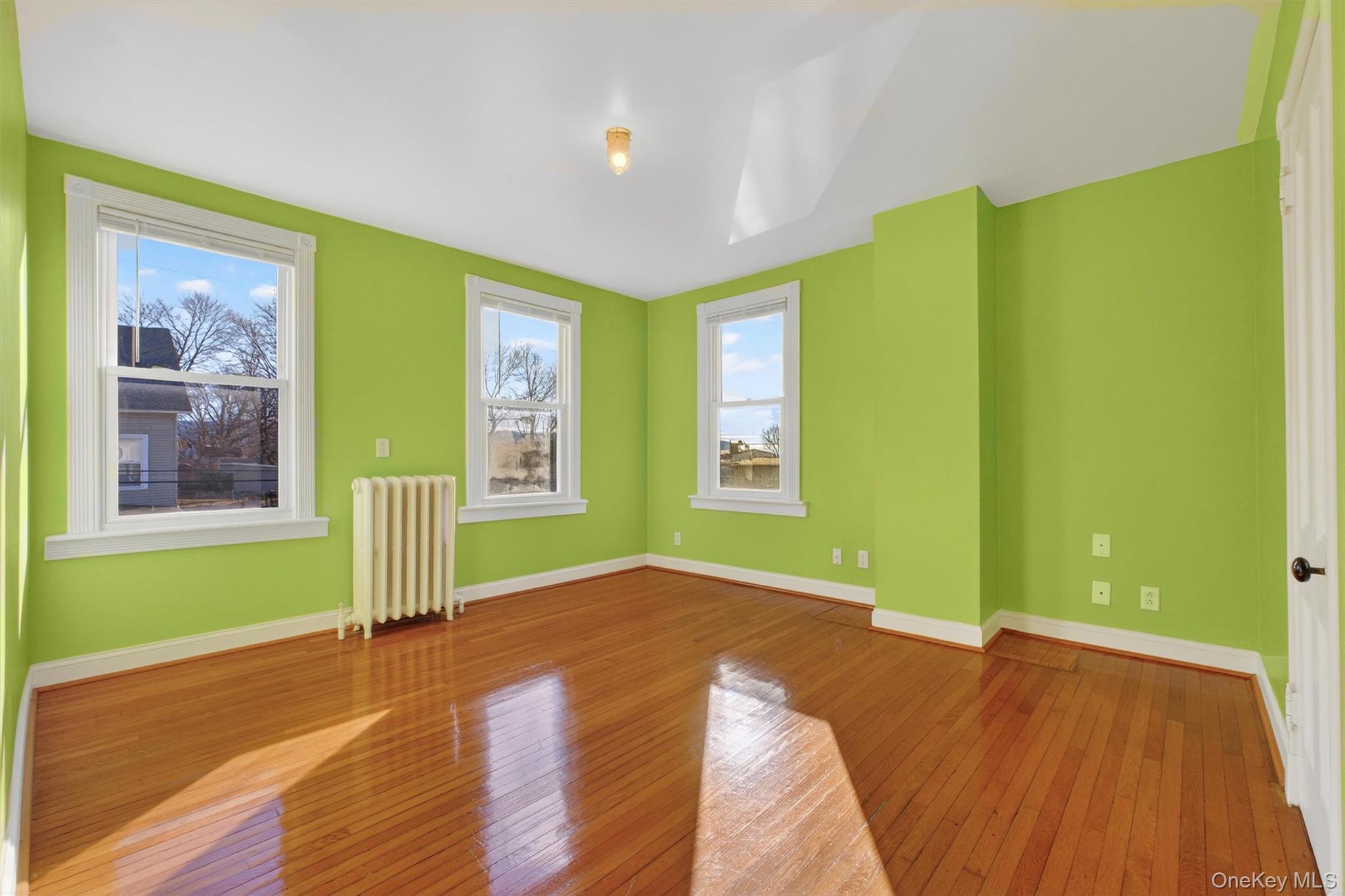 75 Prospect Street Newburgh, NY 12550 - Photo 27 of 37 a bedroom with a bed and a window