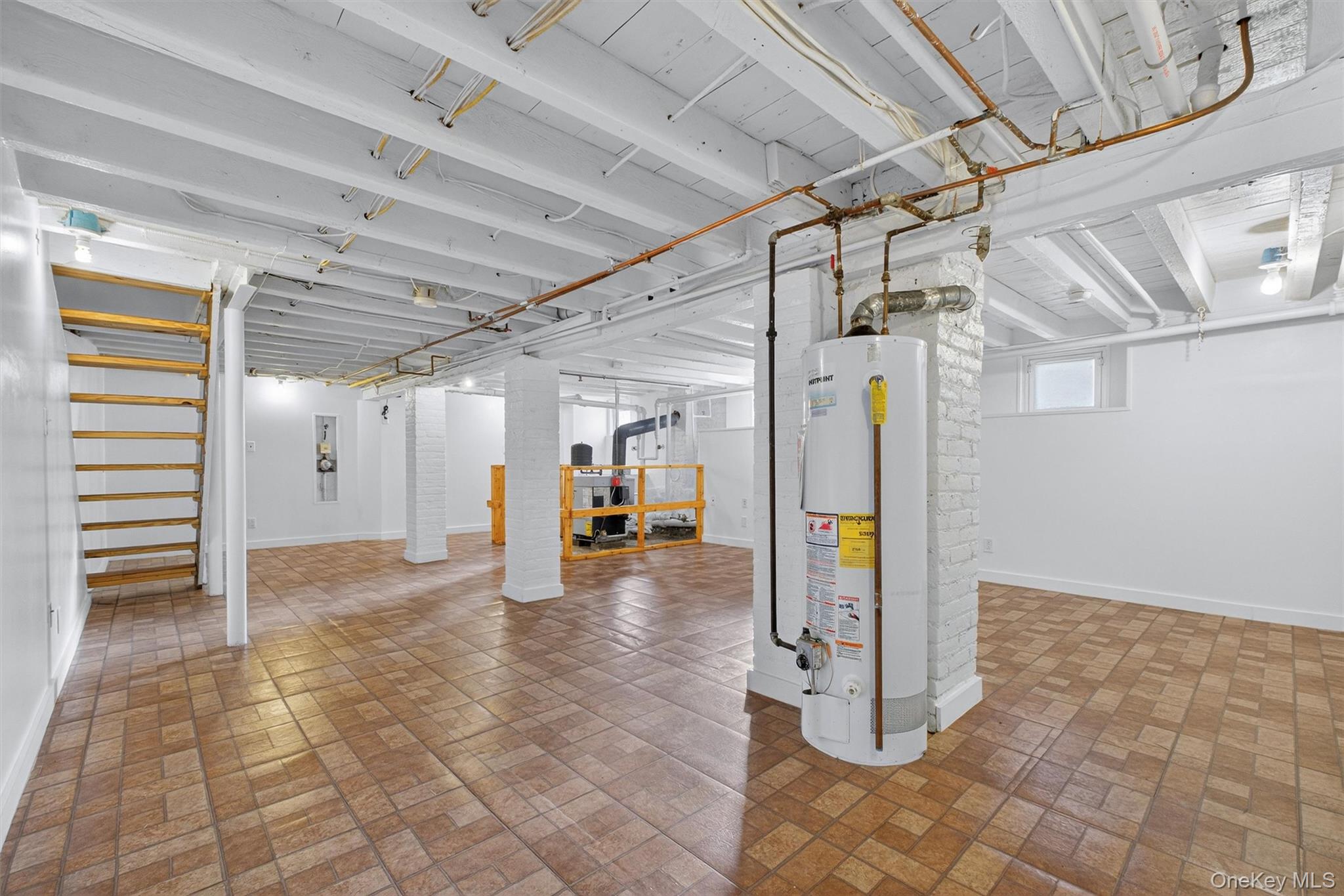 75 Prospect Street Newburgh, NY 12550 - Photo 32 of 37 a view of water heater room with stairs