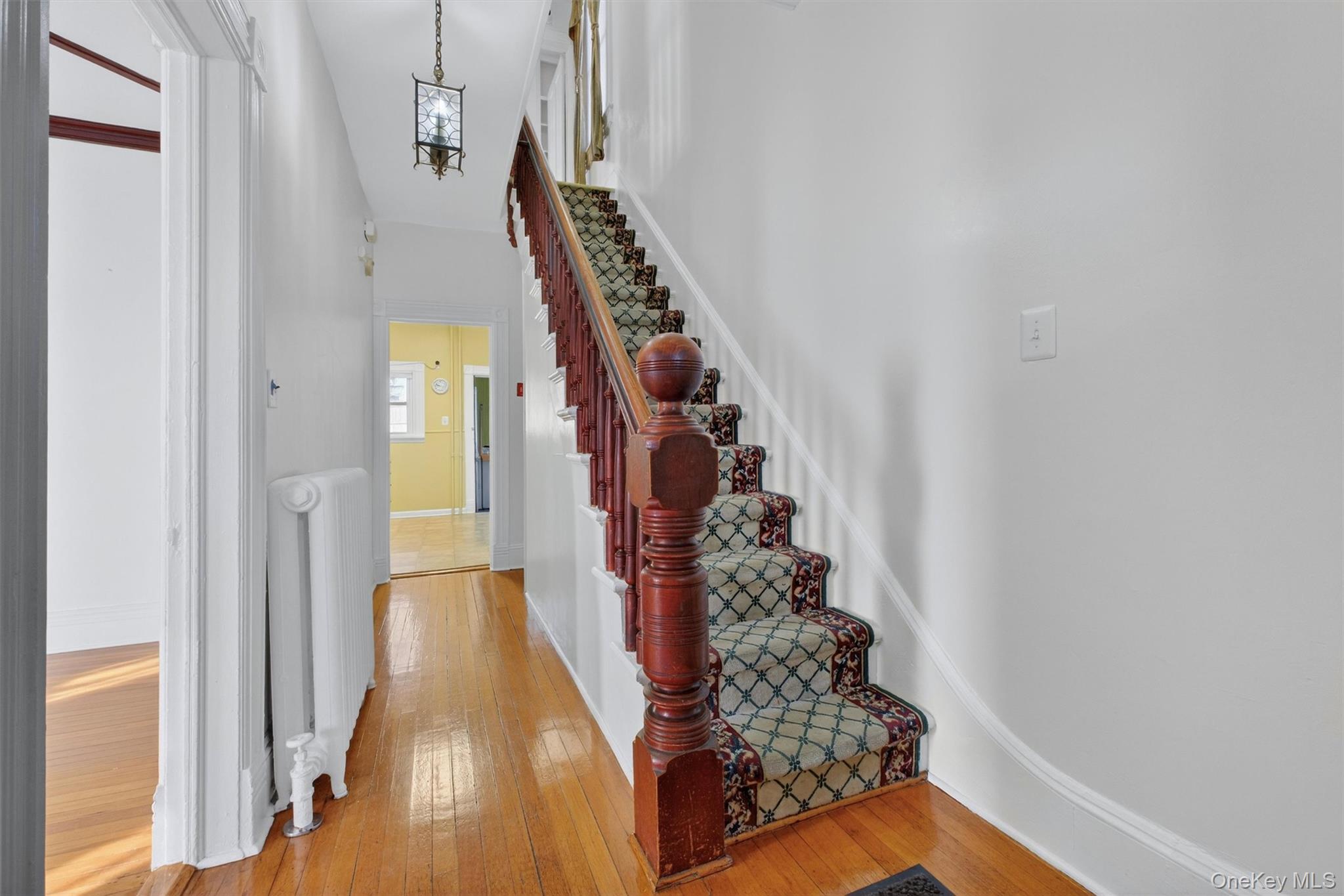 75 Prospect Street Newburgh, NY 12550 - Photo 4 of 37 a view of a hallway with wooden floor and entryway