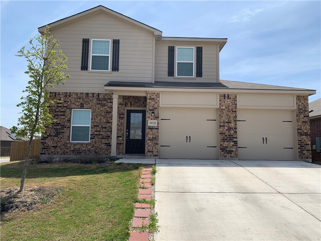 19721 Hubert R Humphrey Road Manor, TX 78653 - Photo 1 of 1 a front view of a house with a yard