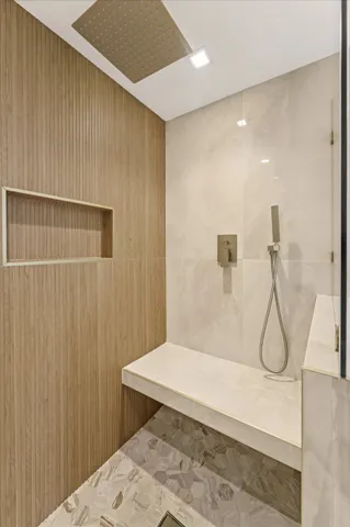 a bathroom with a bathtub and a shower
