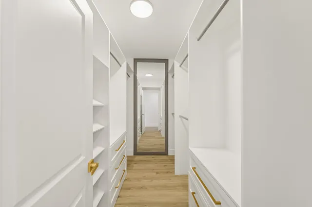 a bathroom with a tub and shower