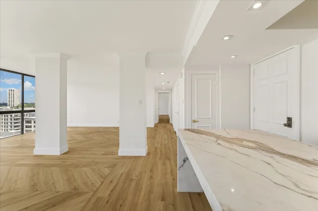 a open kitchen with stainless steel appliances granite countertop a sink and a refrigerator