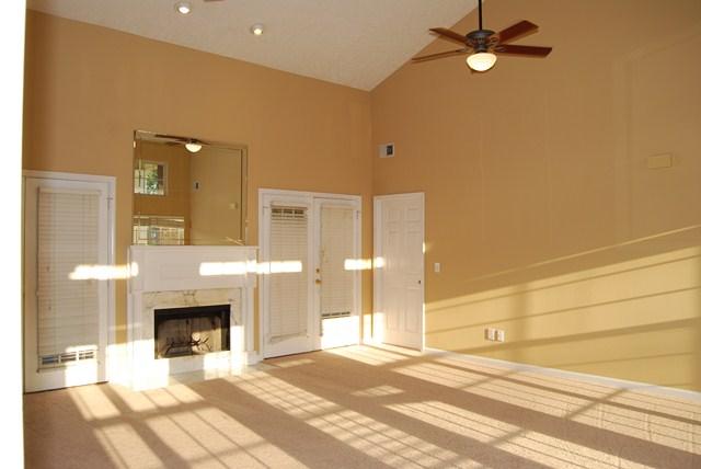 544 Windy Road Mount Juliet, TN 37122 - Photo 3 of 20 a view of a livingroom with a fireplace a ceiling fan and wooden floor