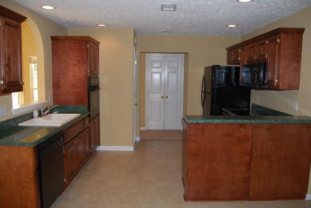 544 Windy Road Mount Juliet, TN 37122 - Photo 6 of 20 a kitchen with stainless steel appliances granite countertop a sink and a stove
