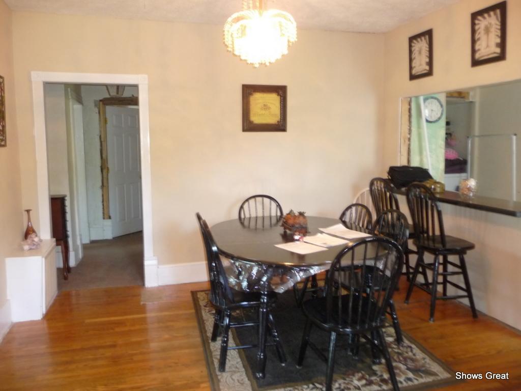1533 Webster Road Roanoke, VA 24012 - Photo 7 of 10 a view of a dining room with furniture and chandelier