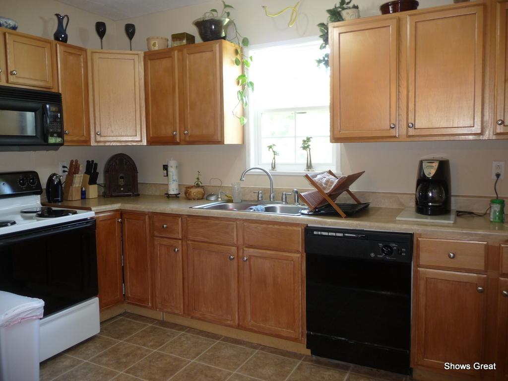 1533 Webster Road Roanoke, VA 24012 - Photo 8 of 10 a kitchen with stainless steel appliances granite countertop a sink and cabinets