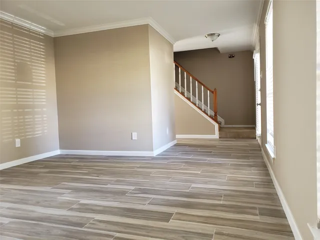 a view of a hallway view with staircase