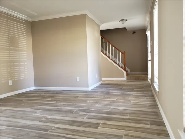 a view of a hallway view with staircase