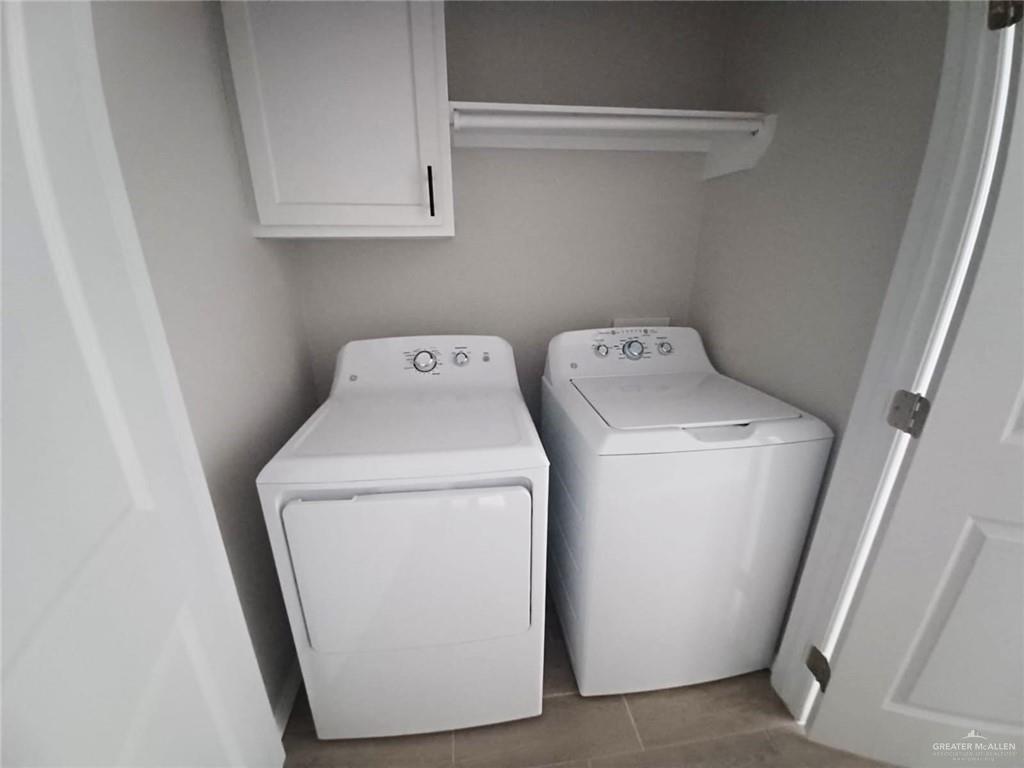 1630 Playa Drive, Unit 1 Weslaco, TX 78596 - Photo 13 of 13 a utility room with dryer and washer
