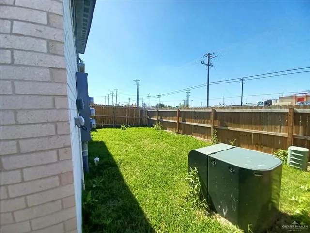 a view of a backyard with sitting area