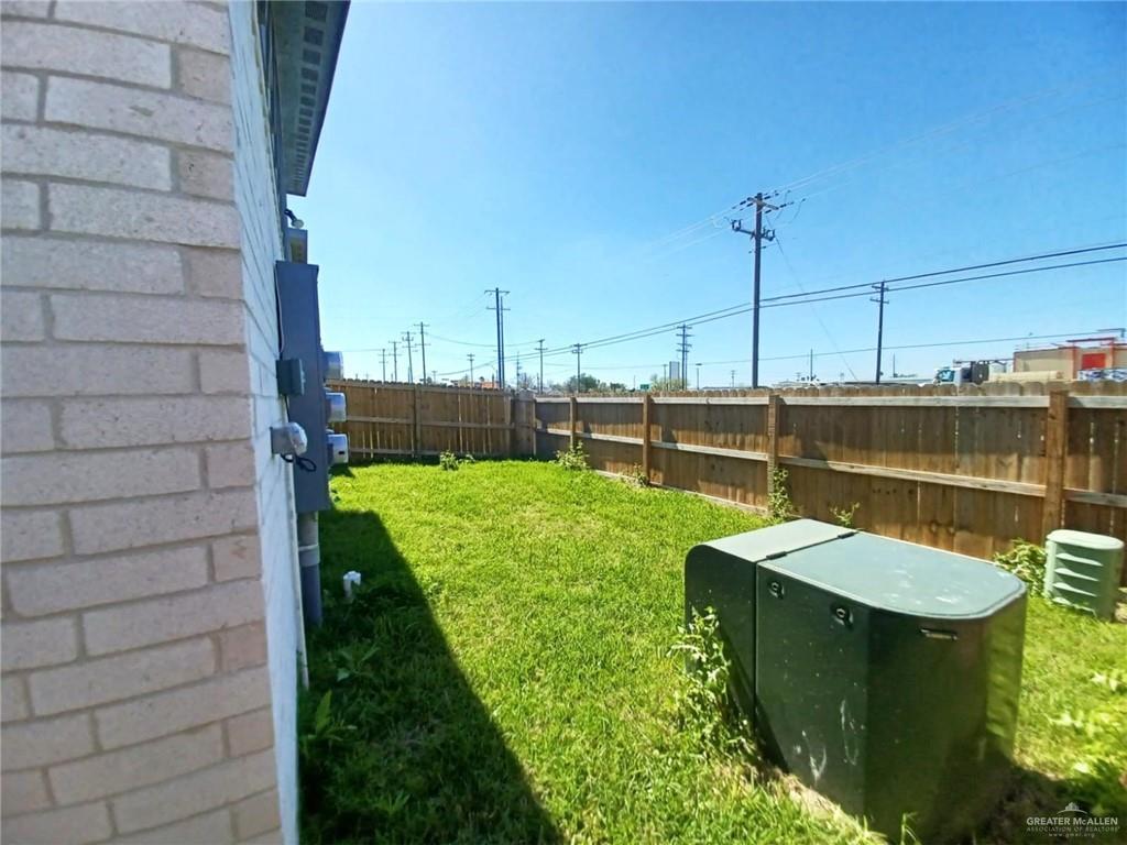 1630 Playa Drive, Unit 1 Weslaco, TX 78596 - Photo 2 of 13 a view of a backyard with sitting area