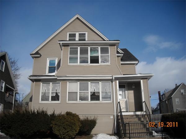 31-33 Coomes Street Springfield, MA 01108 - Photo 1 of 1 a front view of a house with a yard