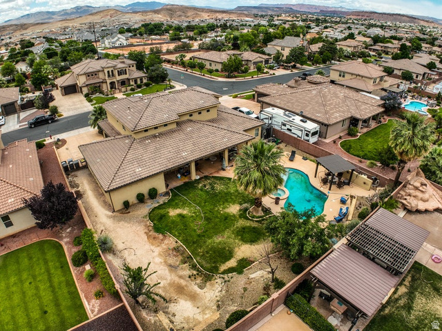 3683 South 2640 West St. George, UT 84790 - Photo 23 of 41 Expansive backyard featuring a freeform swimming pool, integrated spa, and mature palm trees