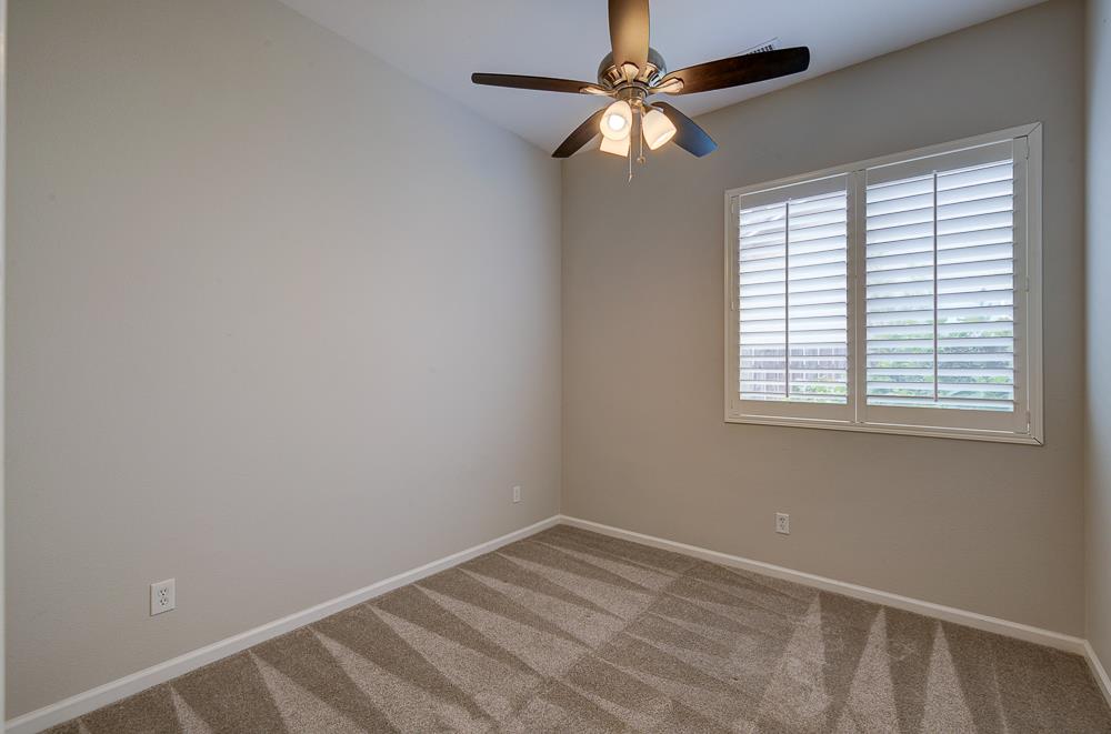 3235 Rall Avenue Clovis, CA 93619 - Photo 23 of 33 an empty room with a window and a fan