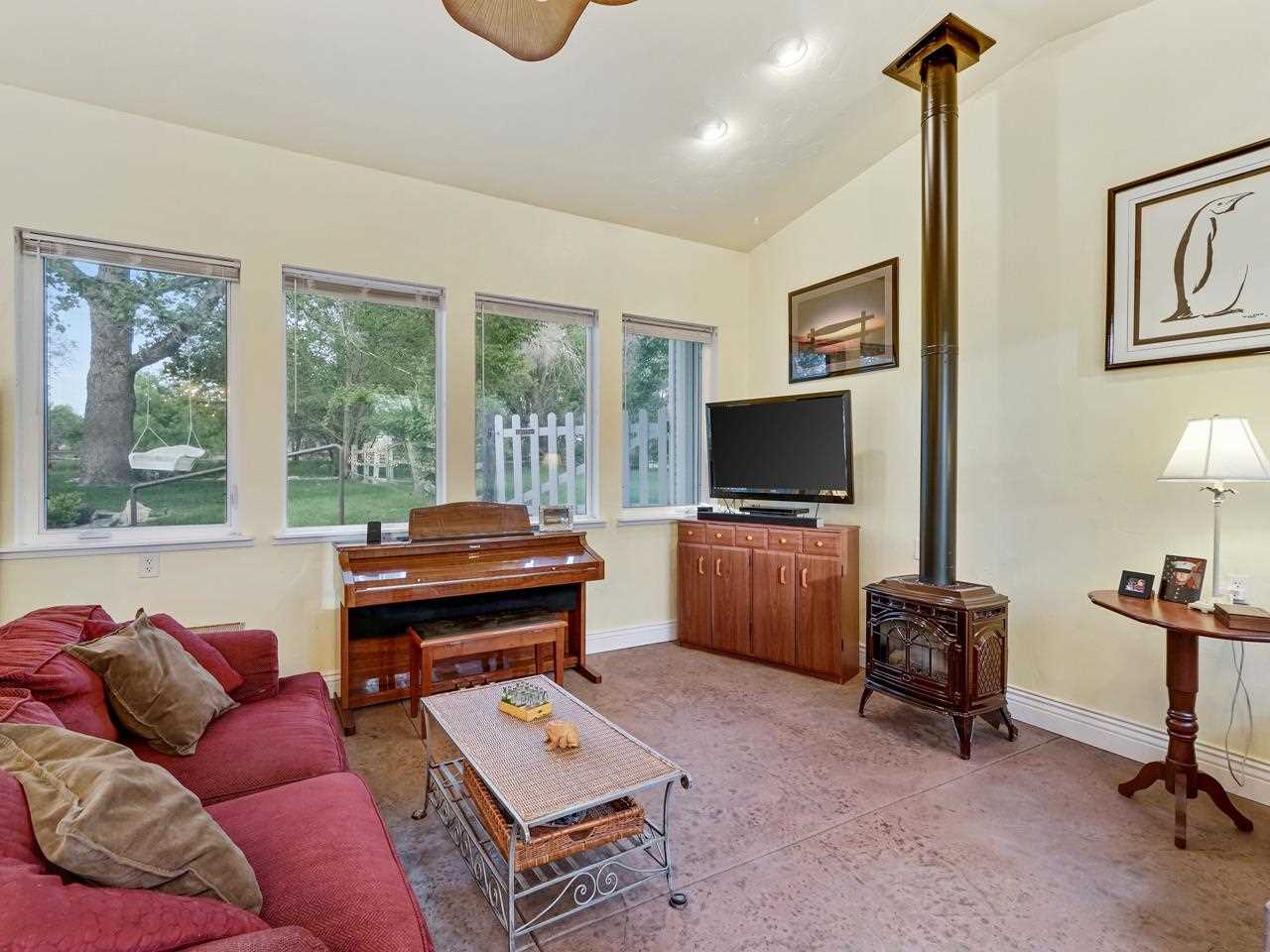 662 26 Road Grand Junction, CO 81506 - Photo 27 of 42 a living room with furniture and a flat screen tv