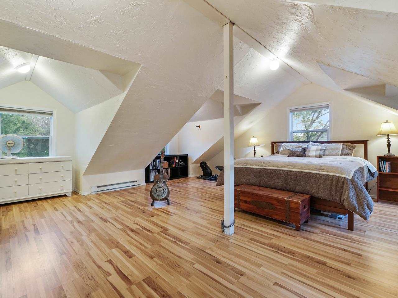 662 26 Road Grand Junction, CO 81506 - Photo 29 of 42 a bedroom with furniture and a wooden floor