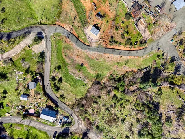 a view of a field with trees in the background