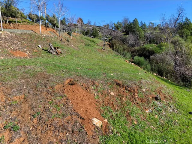 an aerial view of a residential houses with outdoor space