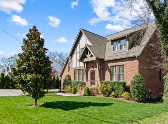 611 Estes Road Nashville, TN 37215 - Photo 1 of 27 a front view of a house with a yard