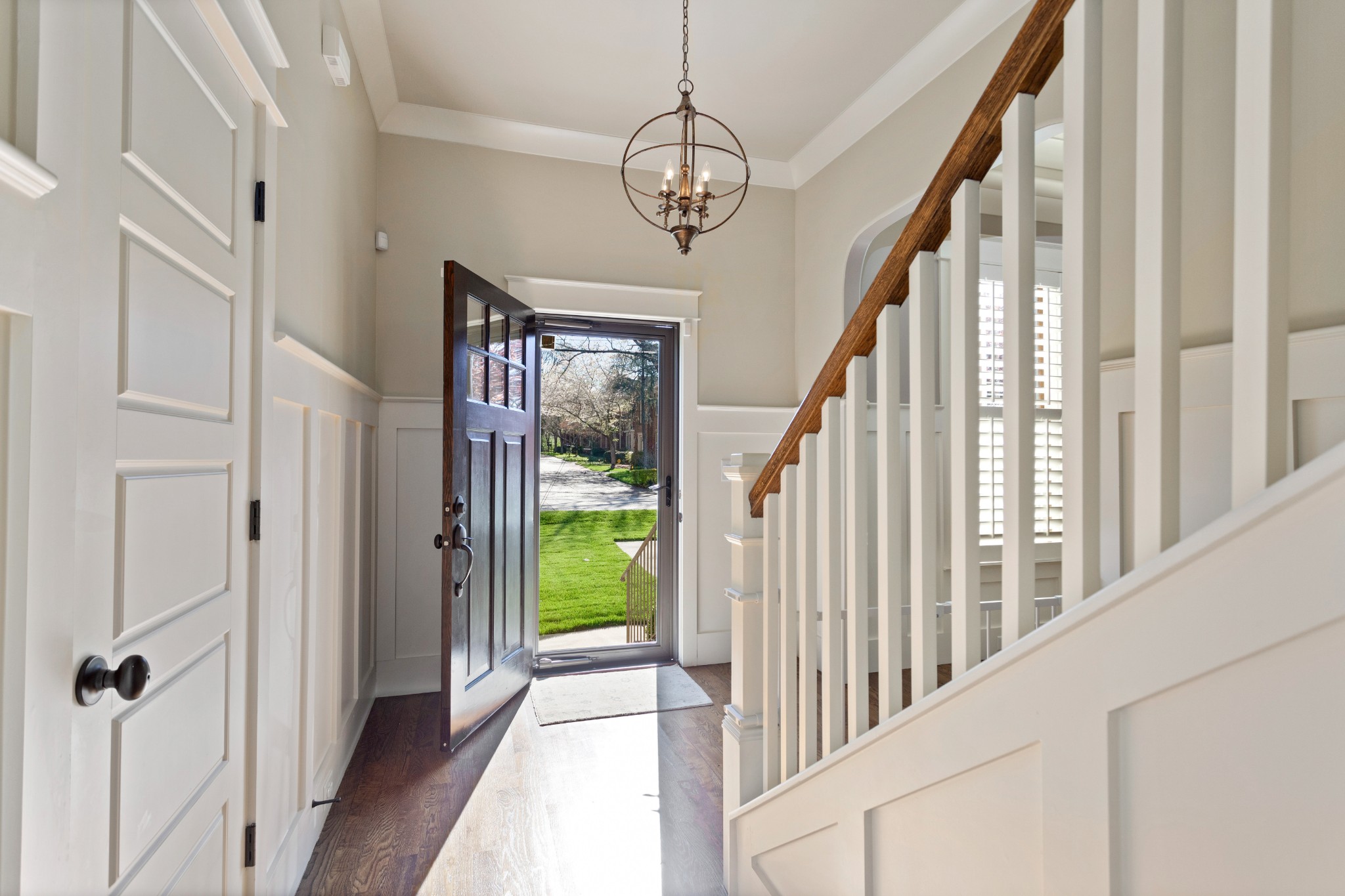 611 Estes Road Nashville, TN 37215 - Photo 3 of 27 a view of a hallway with wooden floor and stairs