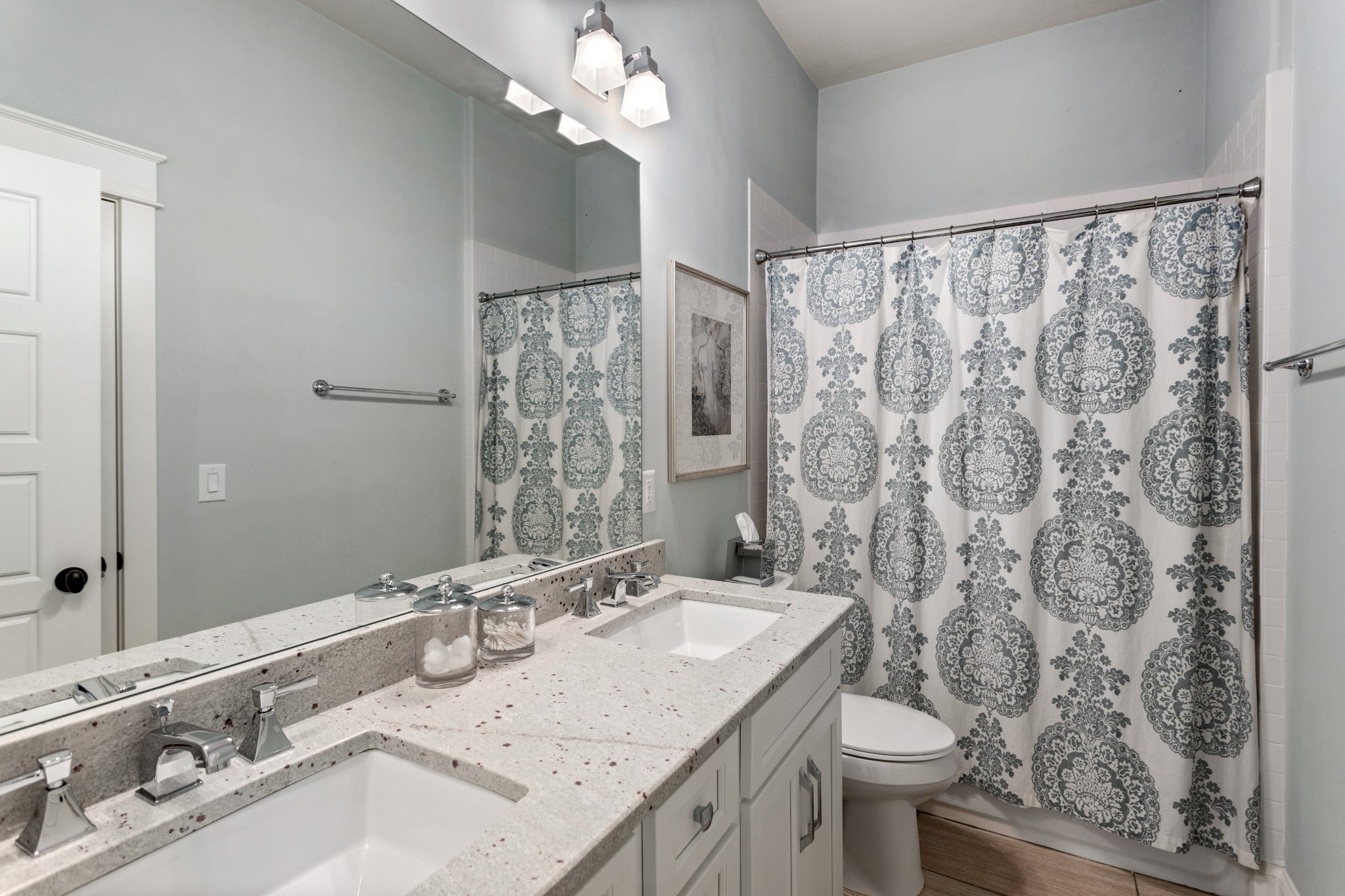 611 Estes Road Nashville, TN 37215 - Photo 21 of 27 a bathroom with a granite countertop sink a toilet and a mirror