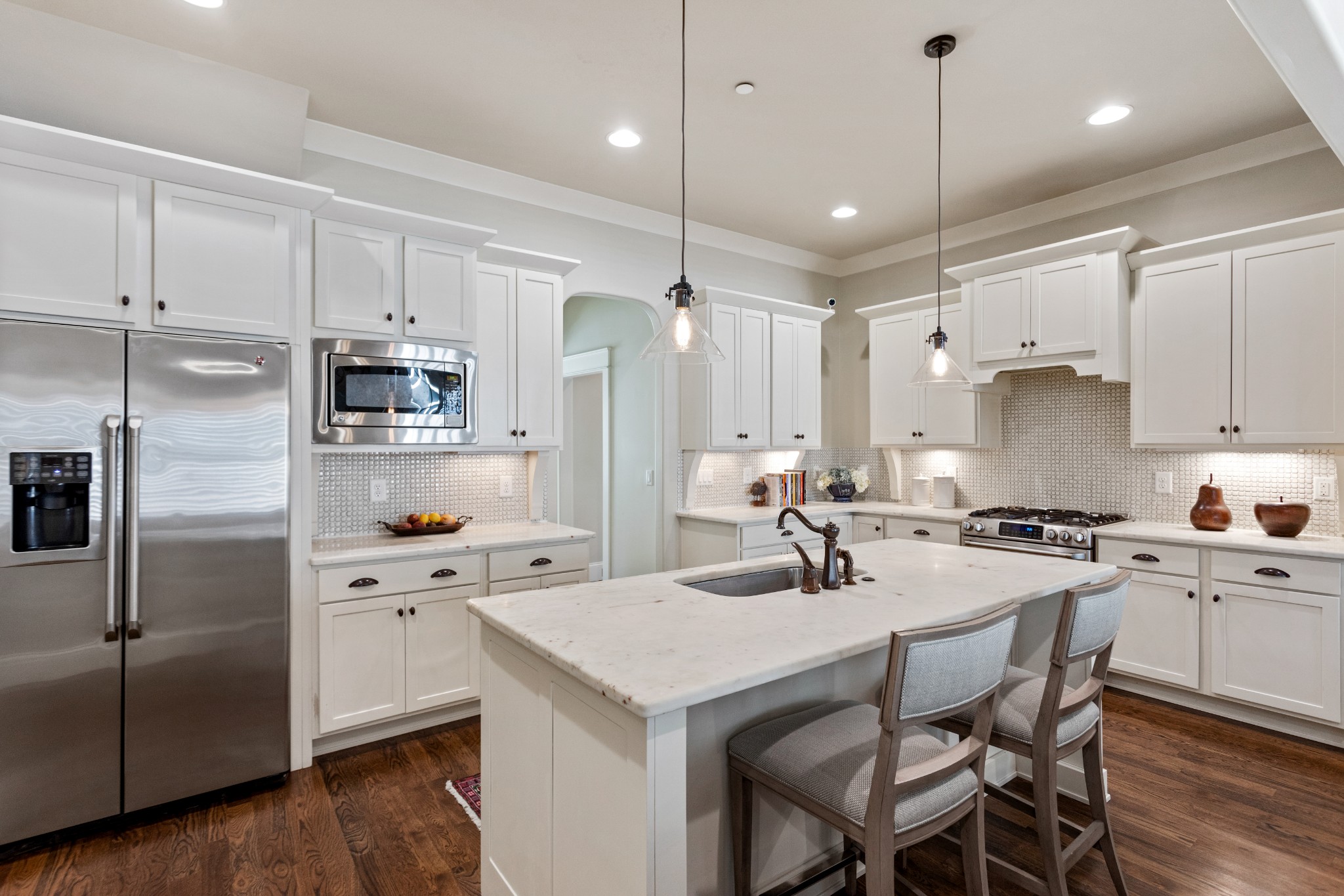 611 Estes Road Nashville, TN 37215 - Photo 7 of 27 a kitchen with a stove a sink a refrigerator and chairs