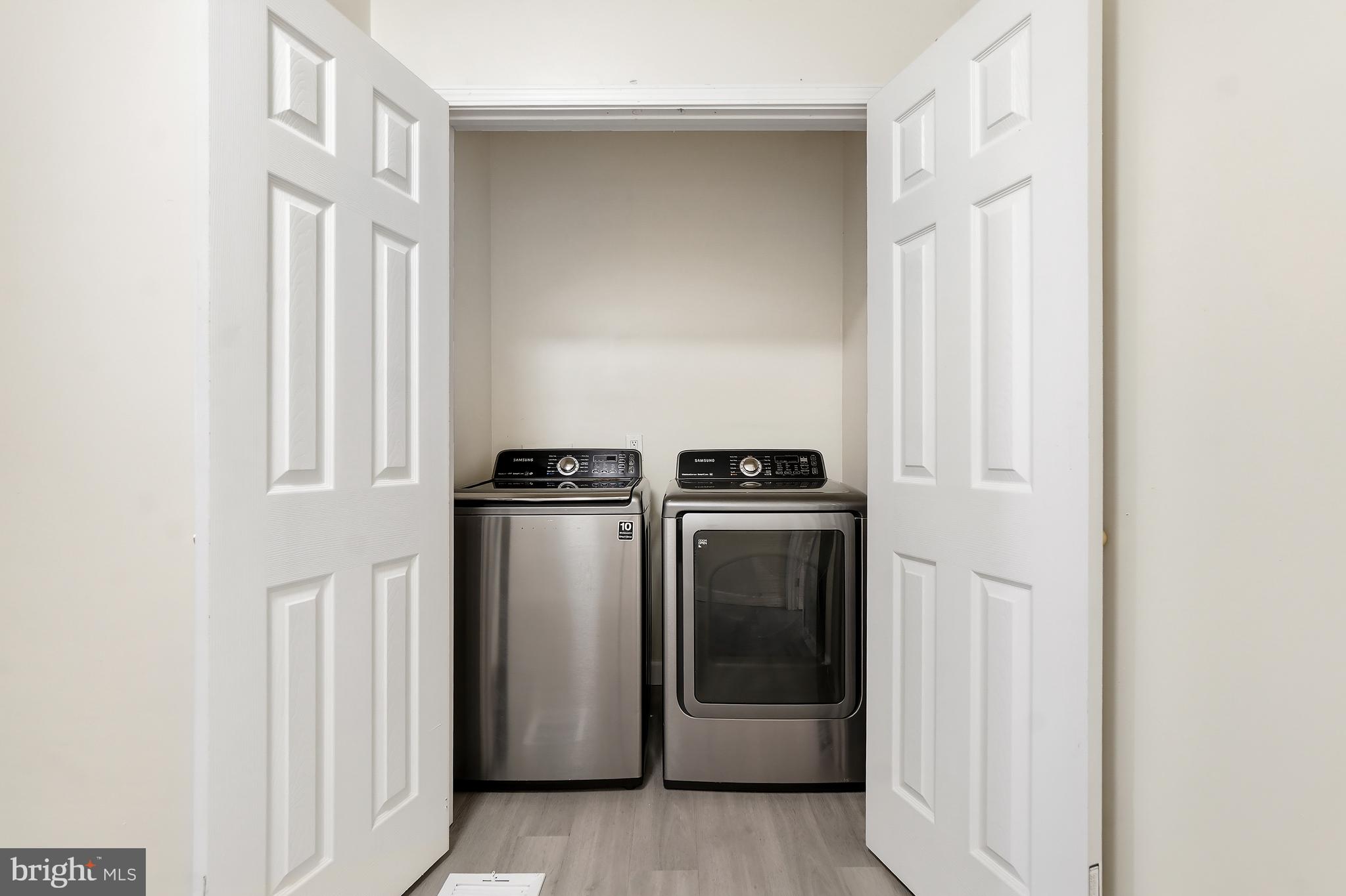 2427 East Lanvale Street Baltimore, MD 21213 - Photo 16 of 29 a view of a kitchen with washer and dryer
