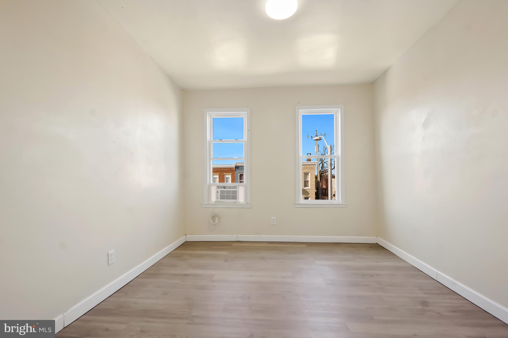 2427 East Lanvale Street Baltimore, MD 21213 - Photo 19 of 29 an empty room with a window