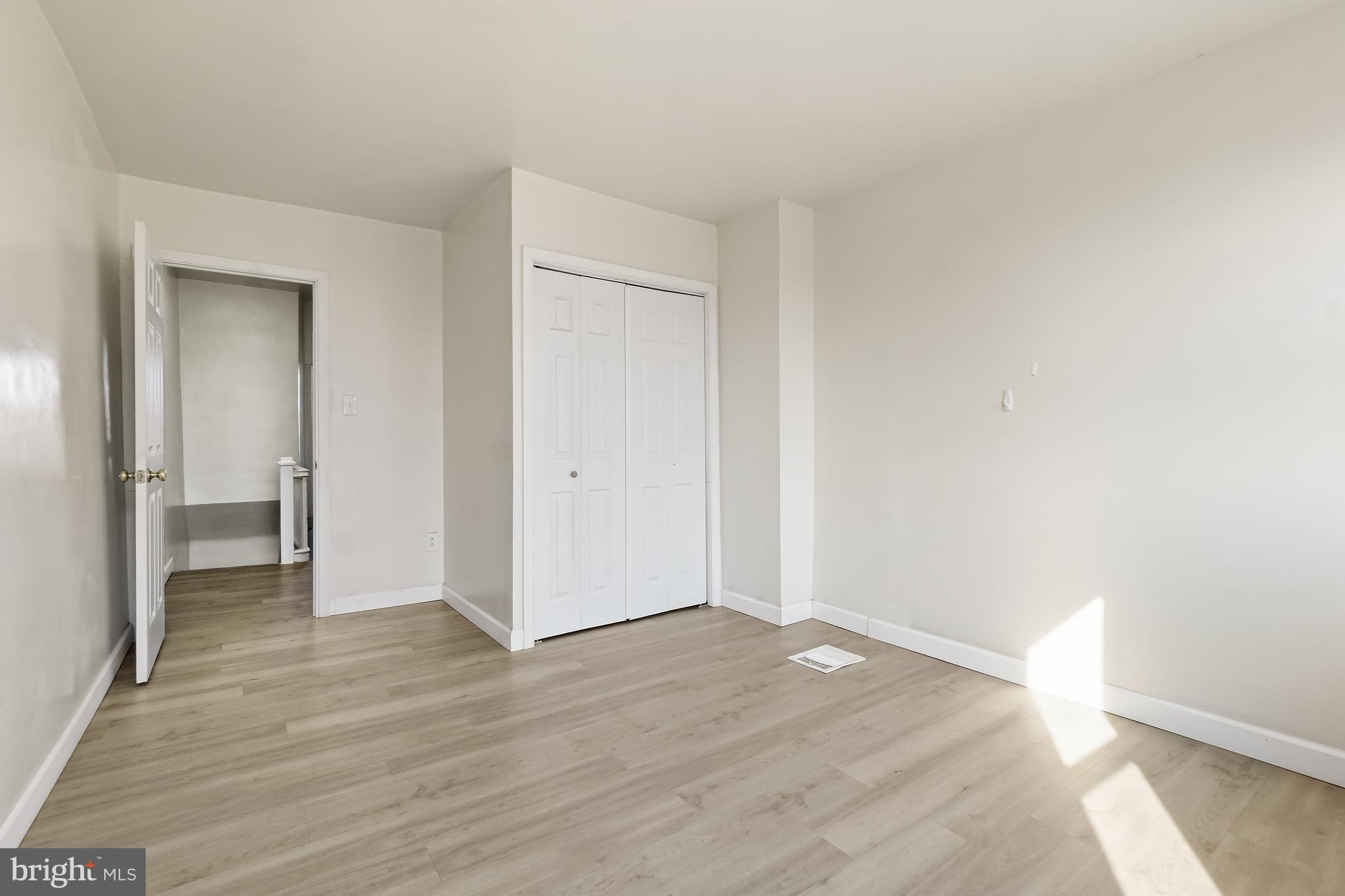 2427 East Lanvale Street Baltimore, MD 21213 - Photo 25 of 29 a view of wooden floor in an empty room