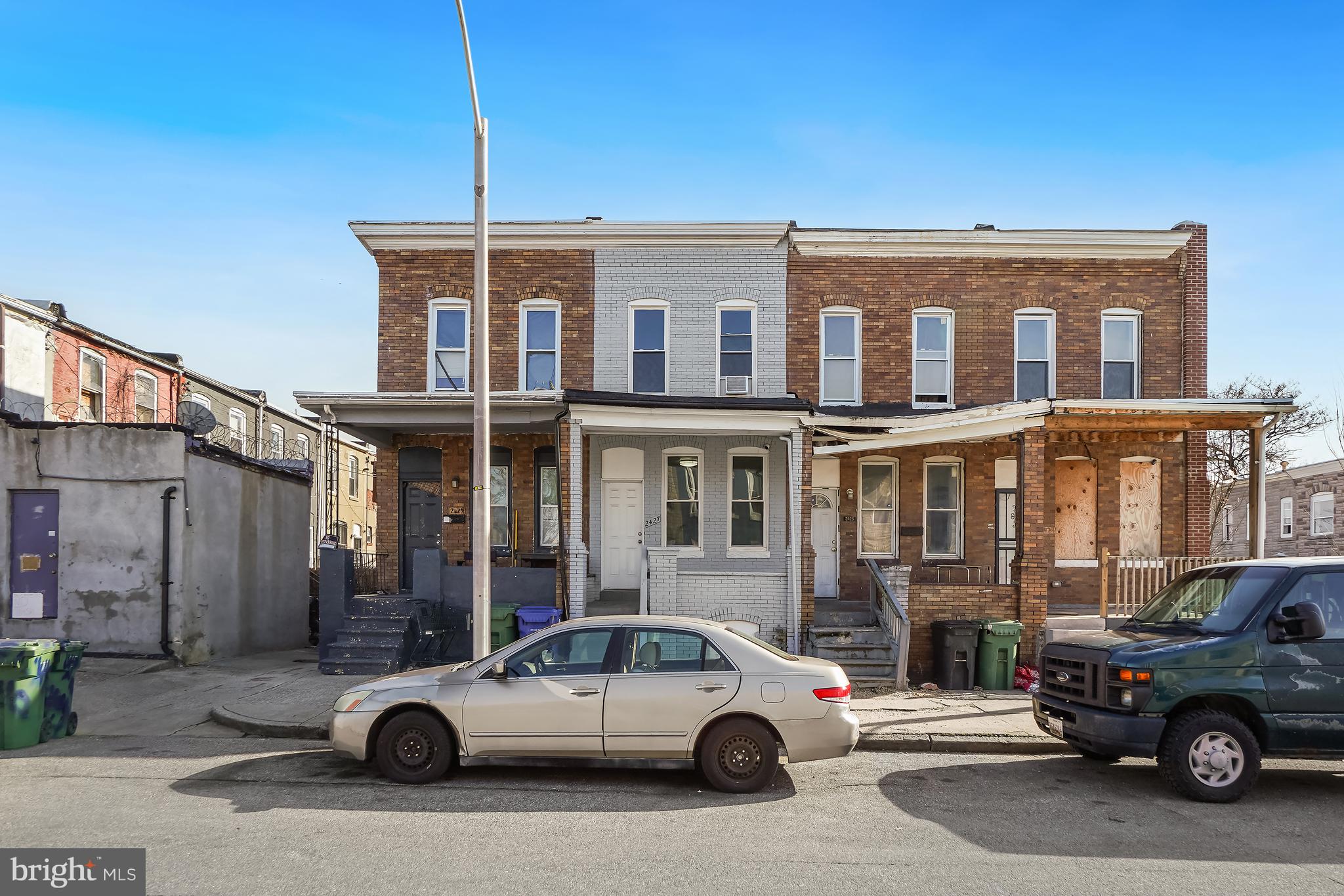 2427 East Lanvale Street Baltimore, MD 21213 - Photo 3 of 29 a view of a car parked in front of a building