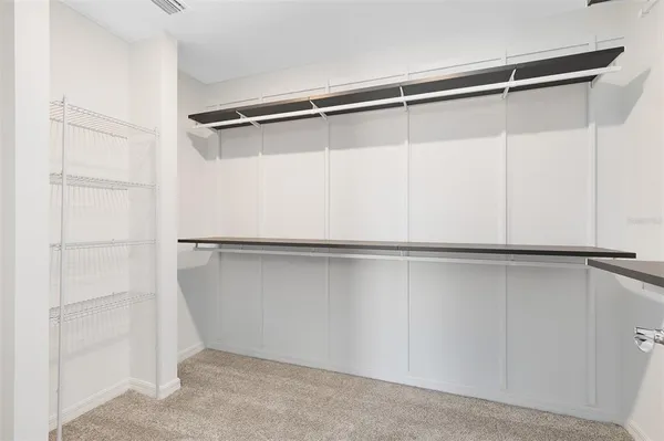 a view of an empty walk in closet