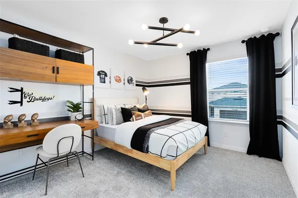 a bedroom with a bed chair and the window