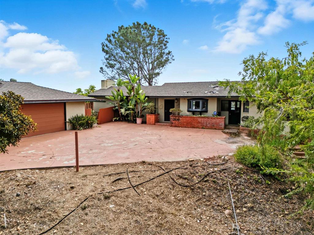 1645 Los Altos Road San Diego, CA 92109 - Photo 16 of 19 a view of a house with a yard