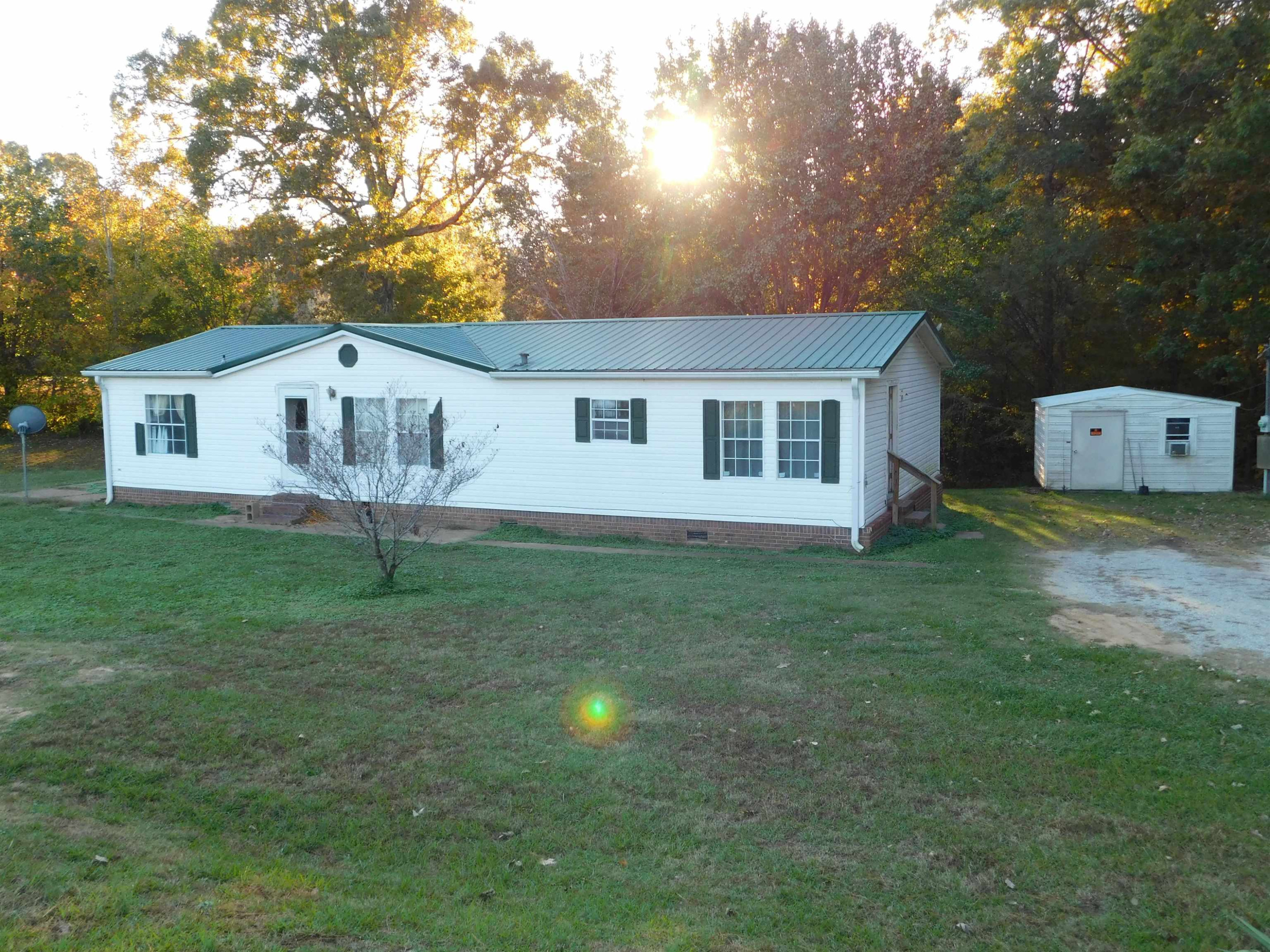 479 Fowler Road Beech Bluff, TN 38313 - Photo 1 of 18 a front view of a house with a yard and trees